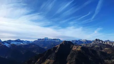 a view of a mountain range under a blue sky at Appartamento Blank in Arabba