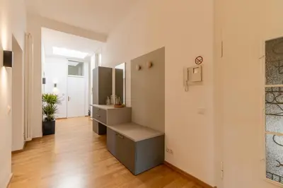 a bathroom with a sink and a counter in a room at Villa Stubai - Penthouse in the heart of Merano in Merano