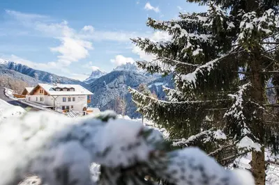 a house in the mountains covered in snow at MOUNTAIN RESIDENCE ALPENHOF - company Hotel Alpenhof KG sas der Gasser Renate in Bressanone