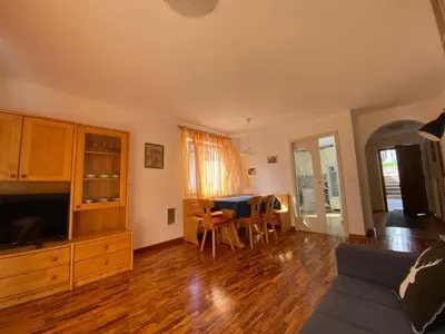a living room with a couch and a table at Amalia Apartment in Santa Cristina in Val Gardena