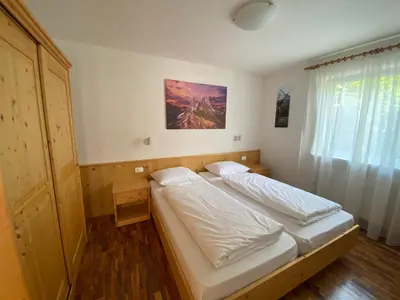 a bedroom with a bed in a room at Amalia Apartment in Santa Cristina in Val Gardena