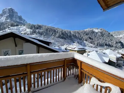 a balcony with a view of a snowy mountain at Amalia Apartment in Santa Cristina in Val Gardena