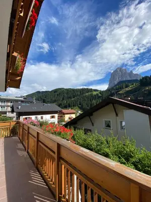 a balcony with a view of a mountain at Amalia Apartment in Santa Cristina in Val Gardena