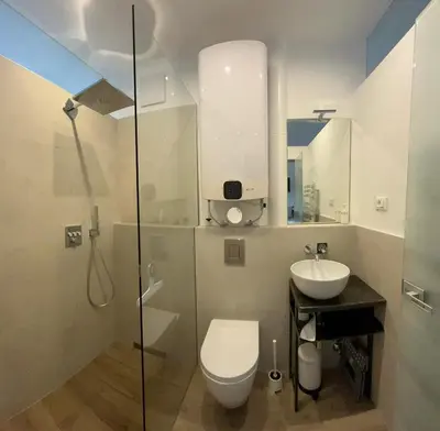 a bathroom with a toilet and a sink at Apartment Mia in Merano