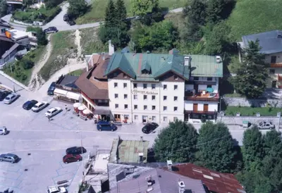 an overhead view of a building with a parking lot at Albergo Antelao in San Vito di Cadore
