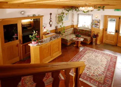 a living room with a couch and a table at Albergo Antelao in San Vito di Cadore