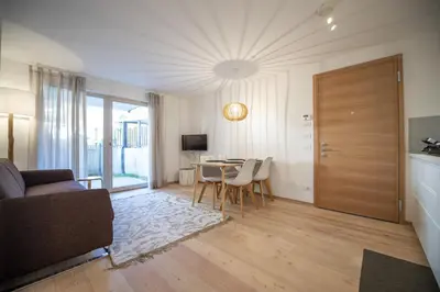 a living room with a couch and a table at Apartment Lulu in Selva di Val Gardena