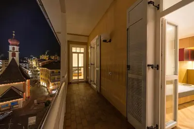 a balcony with a view of a city at Apartment Genziana in Ortisei