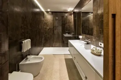a bathroom with a toilet and a sink at Apartment Genziana in Ortisei
