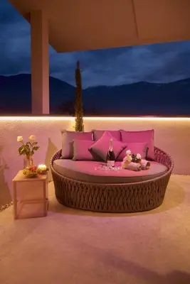 a room with a round bed with a table at Penthouse I CIPRESSI in Postal