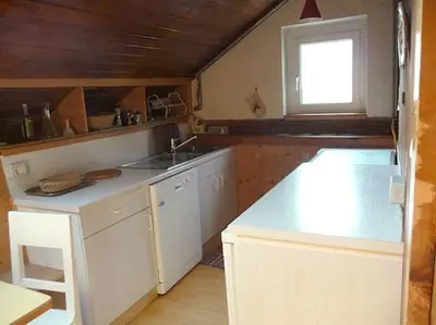 a small kitchen with a sink and a window at ATI Appartamento stile Chalet dell 800 nel cuore di Ortisei in Ortisei
