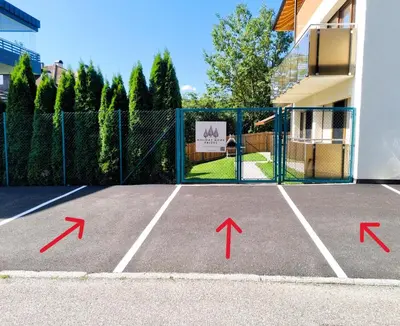 a tennis court with arrows pointing towards a building at Holiday Home Falzes in Falzes