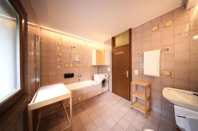 a bathroom with a sink and a bath tub at Holiday Home Falzes in Falzes
