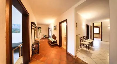 a hallway with a living room and a dining room at Holiday Home Falzes in Falzes