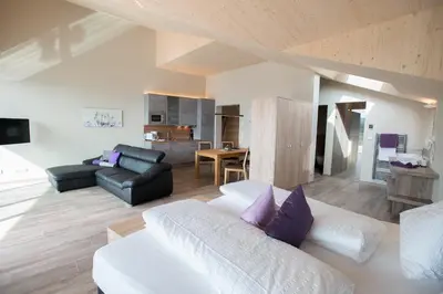 a living room with a couch and a table at Residence Prunarhof in Caldaro