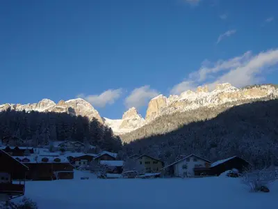 a view from the balcony of a ski resort in the mountains at Casa Davarda in Vigo di Fassa