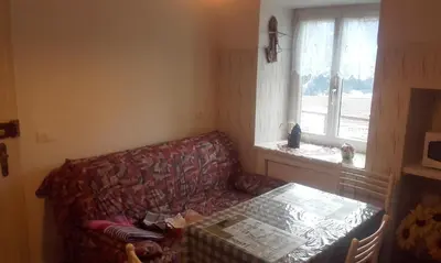 a living room with a couch and a window at B&B Signora Elvira in Capriana