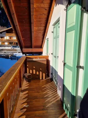 a porch of a house with green doors at Cesa Alegra in Campestrin