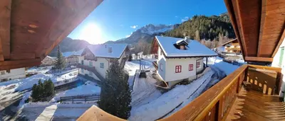 a view from a balcony of a village in the snow at Cesa Alegra in Campestrin