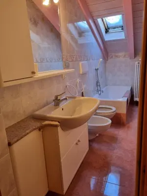 a bathroom with a sink and a toilet and a tub at Cesa Alegra in Campestrin