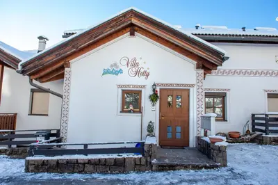 a building with a sign that reads al shhh at Apartment Villa Hetty in Ortisei