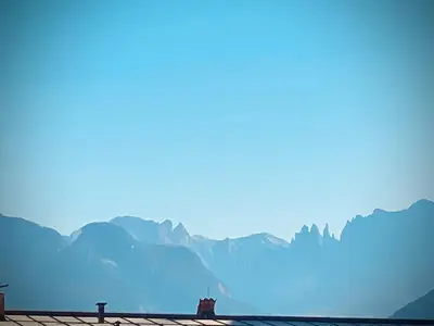 a view of a mountain range in the distance at Duomo 55 MQ new flat in the centre of Bolzano in Bolzano