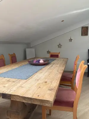 a wooden table with a bowl on top of it at Crystal House in Cavalese