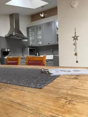 a room with a kitchen with a floor and a counter at Crystal House in Cavalese