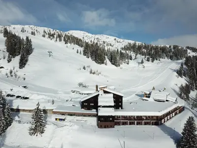 a ski lodge on a snow covered mountain at Casa Eolo Falcade in Falcade
