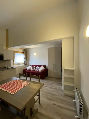 a living room with a couch and a table at CASA LOLA in Falcade