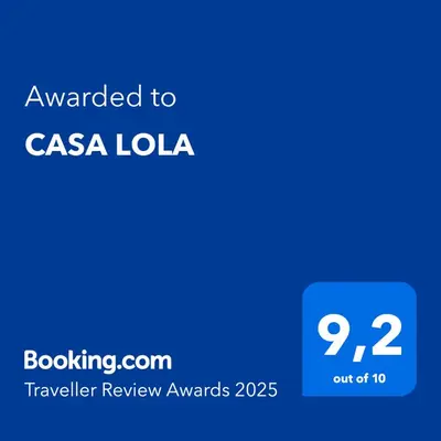 a blue screen with the text awarded to csa lola at CASA LOLA in Falcade