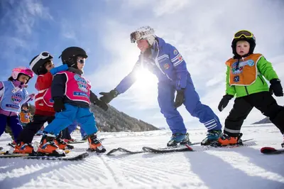 a group of children on skis in the snow at Gitschberg - Appartements in Vandoies