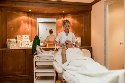 a woman in a hospital room with a patient at Villa Genziana in Selva di Val Gardena