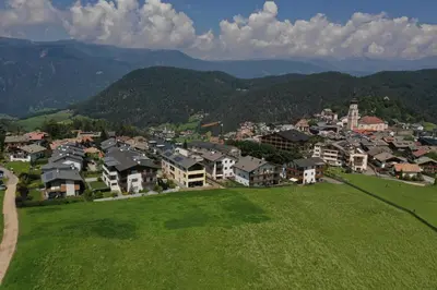 an aerial view of a small town in a green field at Apartments Helga in Castelrotto