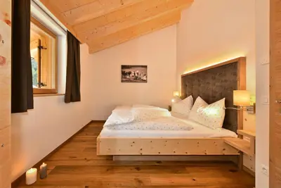 a bedroom with a bed in a room at Proihof in Funes