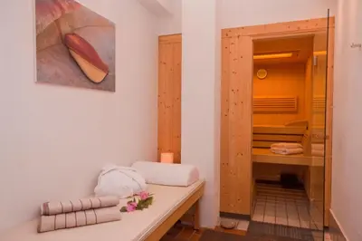 a bathroom with a sink and a mirror at Ferienwohnungen St Hippolyt mit Hallenbad in Lagundo