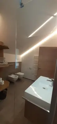 a bathroom with two toilets and a sink at Editlodge 