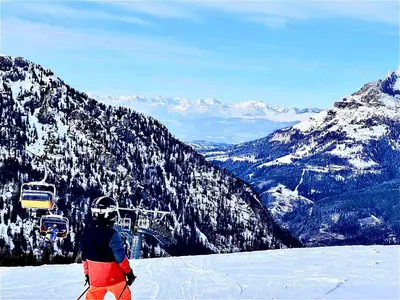 a man on skis standing on a snow covered mountain at EMARGHE, CASA A MOENA in Moena