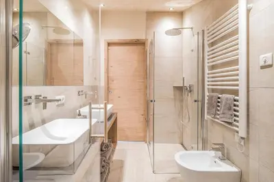 a bathroom with a sink and a shower at Erika Suites & Lofts in Stanghe