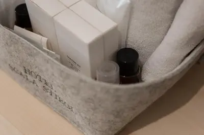 a gray bag with some items in it at Hotel Stiegl Scala in Bolzano