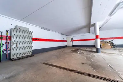 an empty room with skis on the wall at Apartments Agave in Ortisei