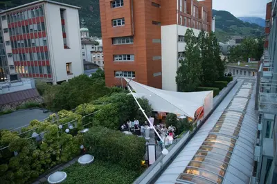 a large white tent hanging from the side of a building at Hotel Greif, a Member of Design Hotels in Bolzano