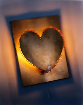 a heart in a picture of a mirror at Hotel Greif, a Member of Design Hotels in Bolzano