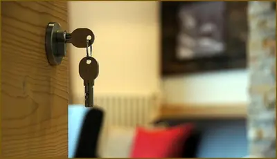 a key is hanging from a door knob at Ciasa Wallis in Badia