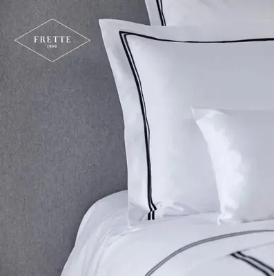 a white pillow sitting on top of a bed at Villa Molin Del Faure in Alleghe