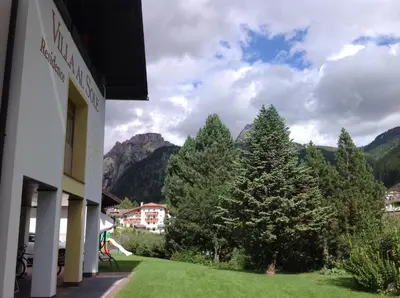 a view of the mountains from a building at Residence Villa al Sole in Selva di Val Gardena