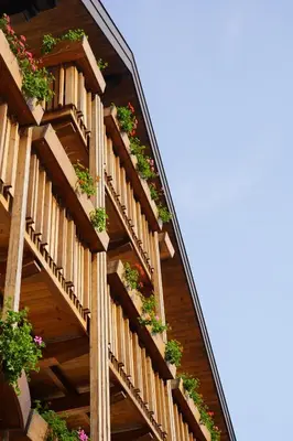 a wooden staircase with potted plants on it at Am Brunnen Apartments in Naz-Sciaves