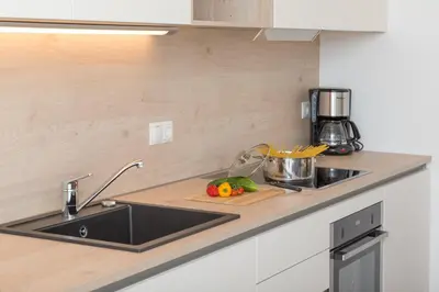 a kitchen with a sink and a counter top at Wiedmairhof in Villa Ottone