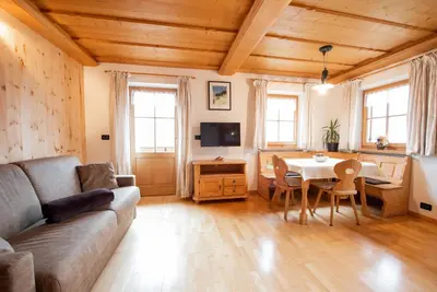 a living room with a couch and a table at Ferienwohnungen Kalchgruberhof in Ultimo