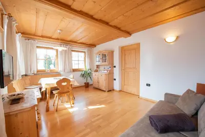 a living room with a couch and a table at Ferienwohnungen Kalchgruberhof in Ultimo